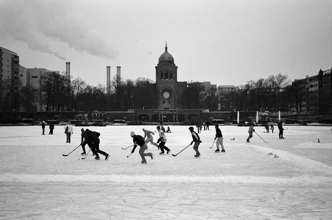 Children and families at an outdoor community skating rink