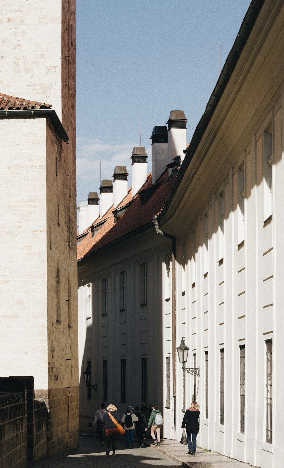 person sweeping alley
