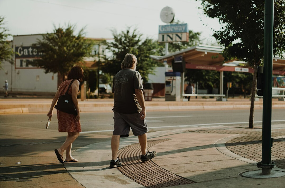 people walking on city sidewalk