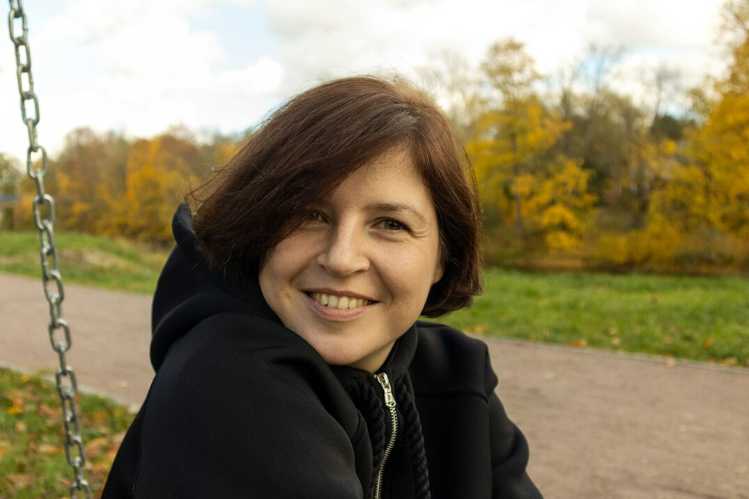 Portrait of a woman with short brown hair smiling