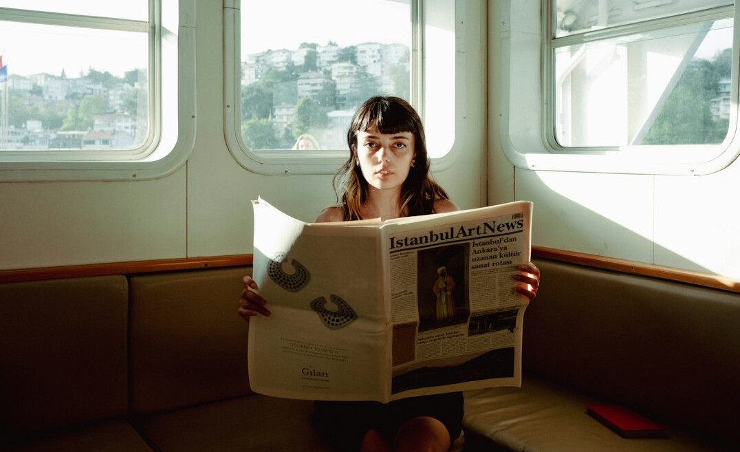 commuter reading newspaper