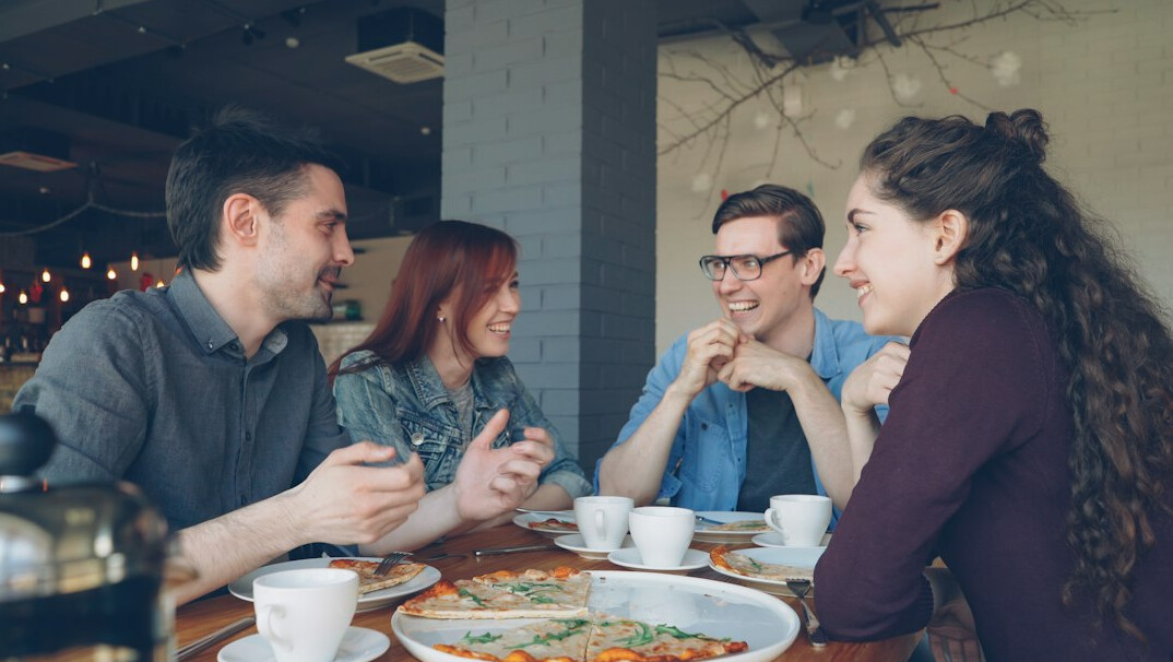 group of friends talking in cafe