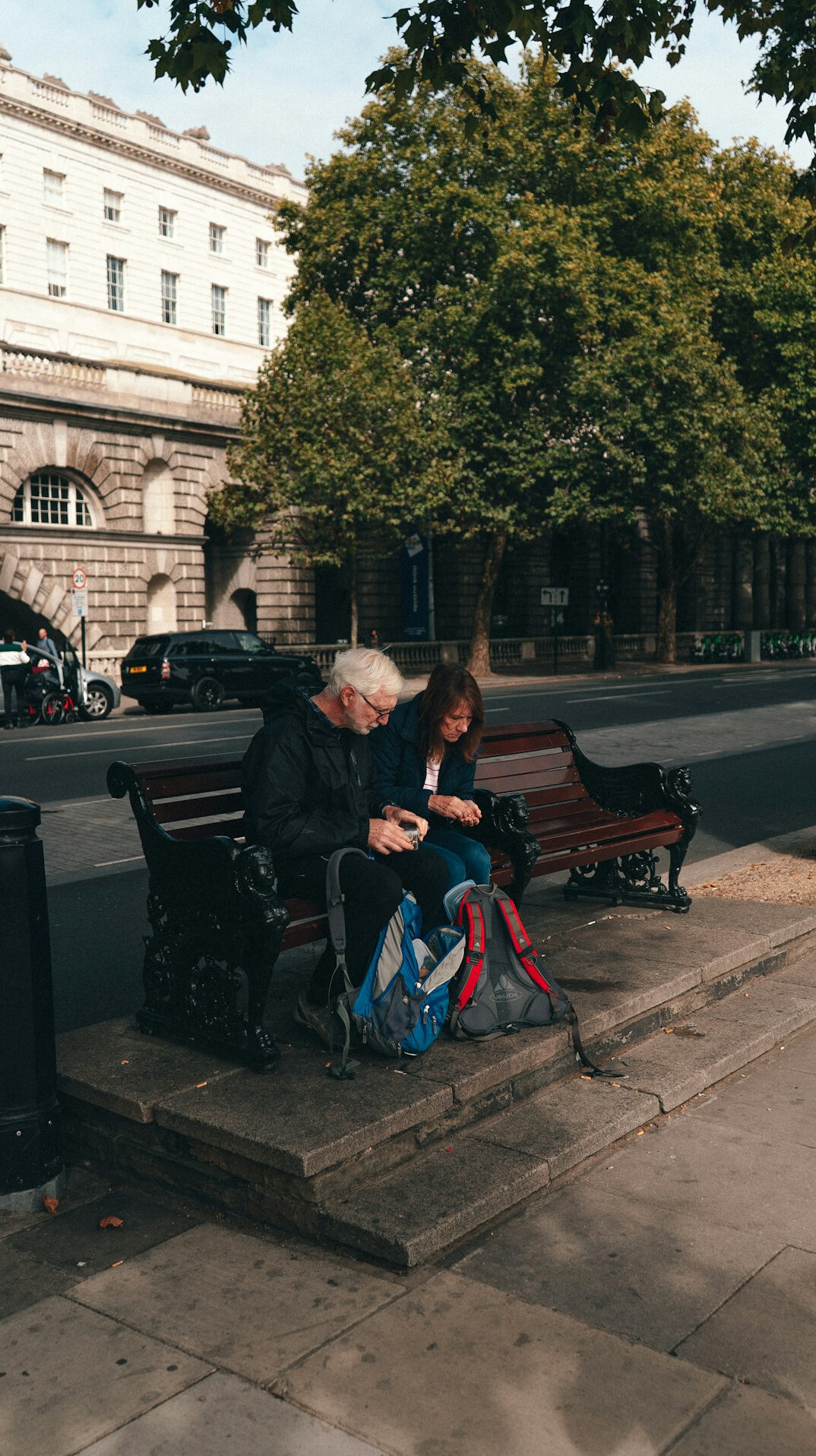 elderly man and woman on bench