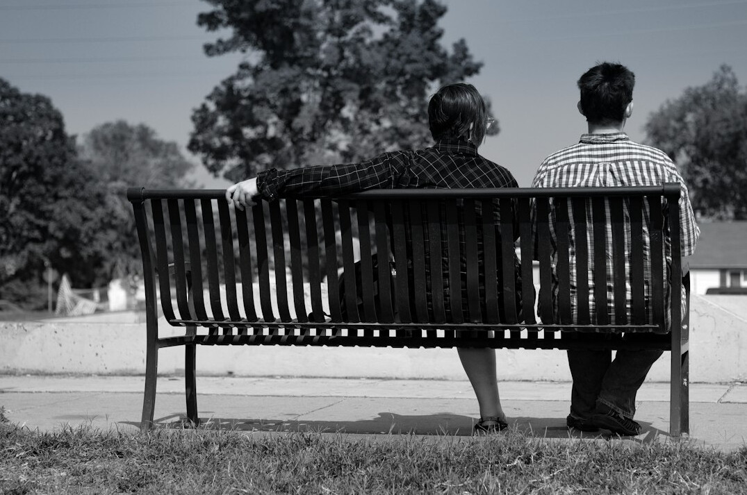 diverse people on park bench